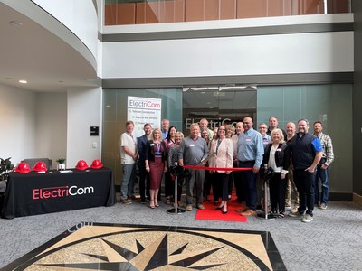 ElectriCom's Executive Chairman Kevin Mason performing the ribbon cutting at ElectriCom's new Alpharetta, Georgia regional office