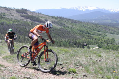 A racer for the Natural Grocers Cycling Team leads the charge at a mountain bike race / Rattler Racing Events in Colorado.