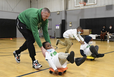 Celtics forward-center Daniel Theis zips around with Fit to Win participants at Dorchester YMCA.