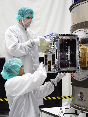 Ryan Fielder and Farid Juman integrating one of HawkEye 360's Cluster 4 satellites to the adaptor ring