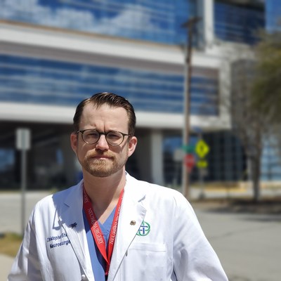 Dr. Christopher Shank stands outside the newly constructed Jane and John Justin Tower. Surgeons on the medical staff now have access to 15 surgery suites in the new, nine-story tower.