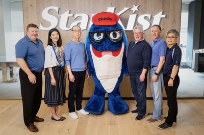 The leadership team with Charlie the Tuna®, comprised of, L-R; Scott Meece, SVP General Counsel; Melody Ge, Director Quality Assurance; Andrew Choe, President & CEO; Charlie the Tuna®, StarKist Spokesfish; Earl Moynihan, VP Supply Chain; John Casten, VP Sales; Jung Ro Ki, SVP, CFO Finance; Photo Credit: Anfon Ha