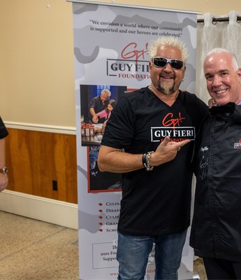 Guy Fieri poses with Suburban Propane President & CEO Michael Stivala at the Guy Fieri Foundation Event on Friday, April 1.