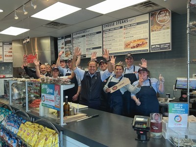 Peter Cancro (center), Founder & CEO, Jersey Mike’s Franchise Systems, Inc., celebrates the company’s Annual Day of Giving at Jersey Mike’s in Point Pleasant Beach at the Jersey Shore where it all began.