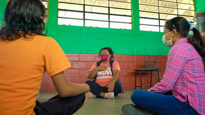 Glasswing program coordinator leads a mindfulness activity for students in Guatemala.