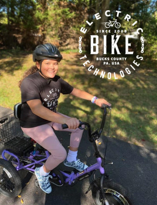 Allison, 11-years old at the time, is enjoying her Liberty Trike donated to her by Electric Bike Technologies.