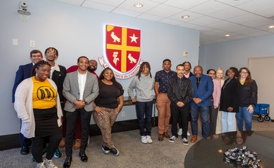 L to R Front Row: Morgan Rasmus, Bread of Life; UST's Brandon Green; student Angel Jackson; student Antoine McCloud; student Kevin Winberry; Pastor of St. John Methodist Church Rudy Rasmus; Deborah Brooks, Collection Action for Youth; Megan Davis, Collection Action for Youth; Back Row: Dr. Jim Monaghan, UST's director of Online Learning, student Justin Howard, student Wesley Alfred, student Ronald Smith; student Chauncey McCloud; Dr. Beena George, UST Chief Innovation Officer and UST's Dr. Beth Barrette