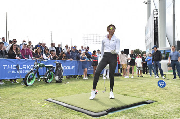 Golf trick shot and lifestyle influencer Tisha Allin plays with a golf ball before her formal swing at The Lakes at El Segundo Golf Course on Monday, April 11, 2022.  (Jordan Strauss/AP Image for Topgolf)