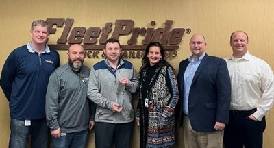 FleetPride CEO Mike Duffy (left) and fellow team members present BorgWarner’s Nicolas Tosie (center) with the 2021 FleetPride Supplier of the Year award in Irving, Texas on Tuesday, Feb. 22, 2022.