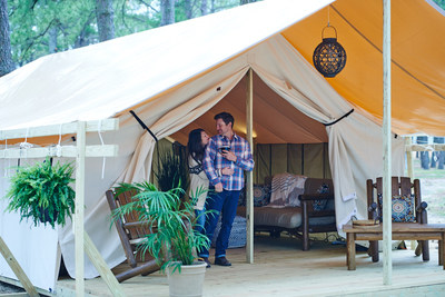 A couple enjoys their premier glamping experience at the Chincoteague Jellystone Camp-Resort.