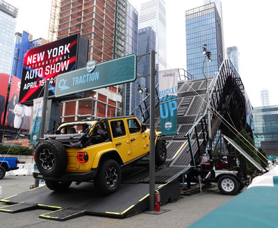 The Jeep® Wrangler 4xe, in all-electric mode, takes on Camp Jeep® New York which has an all-new 28-foot mountain to thrill auto show attendees.
