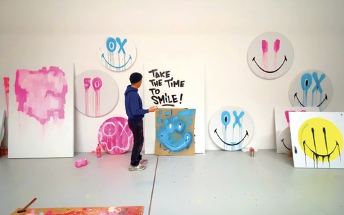 André Saraiva in the studio creating the physical art inspiration for collaboration with Smiley to celebrate the 50th Anniversary Urban Outfitters