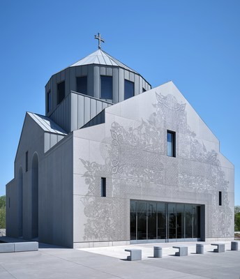 The western Memorial faade of the new Saint Sarkis church serves as a subtle but powerful memorial to the 1.5 million victims of the 1915 Armenian genocide. The faade depicts a traditional Armenian cross or 
