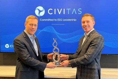 Brian Cain (left) receives Environmentalist of the Year award on behalf of Civitas Resources, presented by Michael Vieau (right) of the nonprofit Fellow Environmental Partners. 04/21/22