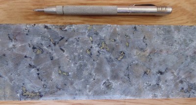 Photo 2: Assay interval returned 1.69 CuEq (1.62% Cu and 0.021% Mo) over 1.5m from 508.9-510.4m.
Bornite rimming chalcopyrite in a texturally obliterated breccia with potassic alteration being overprinted by quartz-sericite-pyrite. (CNW Group/Libero Copper & Gold Corporation.)