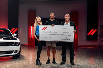 Bill Goldberg and host Katie Osborne present the Dodge brand's Chief Donut Maker check to winner Preston Patterson. (Photo credit: Dodge brand)