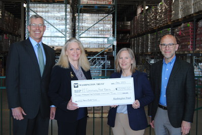 Washington Trust employees, customers and community members raised $13,590 to support the Rhode Island Community Food Bank during the Bank's 22nd annual Peanut Butter Drive. Pictured are Washington Trust representatives Edward O. "Ned" Handy, III, Chairman & CEO and Elizabeth B. Eckel, SVP & Chief Marketing & Corporate Communications Officer, alongside RI Community Food Bank representatives Lisa Roth Blackman, Chief Philanthropy Officer and Andrew Schiff, Chief Executive Officer.