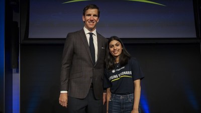 Philanthropist and two-time Super Bowl-winning quarterback Eli Manning congratulates Ella Gupta, 17, of Raleigh, North Carolina on being named one of the Prudential Emerging Visionaries.