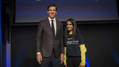 Philanthropist and two-time Super Bowl-winning quarterback Eli Manning congratulates Sahana Mantha, 15, of Charlotte, North Carolina on being named one of the Prudential Emerging Visionaries.