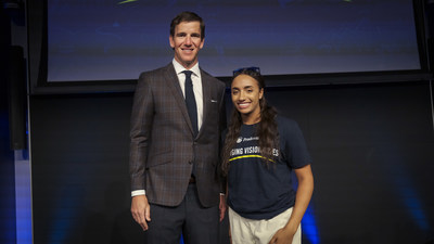 Philanthropist and two-time Super Bowl-winning quarterback Eli Manning congratulates Rachel Holmes, 18, of San Jose, California on being named one of the Prudential Emerging Visionaries.