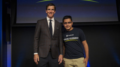Philanthropist and two-time Super Bowl-winning quarterback Eli Manning congratulates Faaris Zuberi, 17, of Rockville, Maryland on being named one of the Prudential Emerging Visionaries.