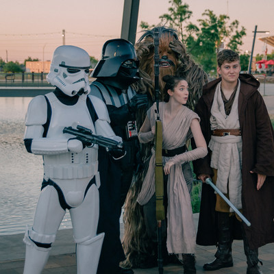 A group of Star Wars enthusiasts celebrate Star Wars Day at Chisholm Creek. From left to right: Storm Trooper, Darth Vader, Chewbacca, Rey and Luke Skywalker.