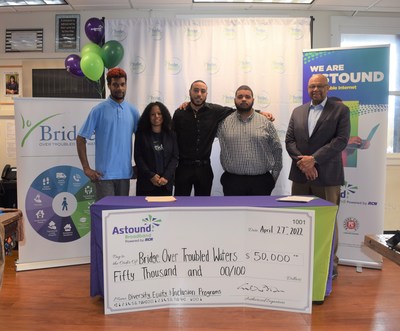 Bridge Over Troubled Waters Youth Join the donation presentation. From left to right: Alex, Elisabeth, Bryan, Juan and Sanford Ames, SVP and GM, Astound Broadband Powered by RCN