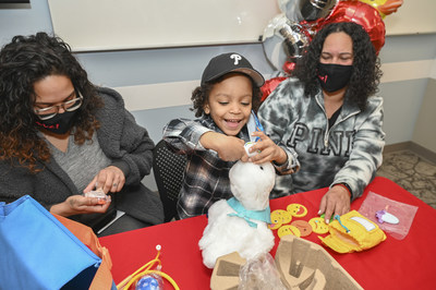 Four year-old sickle cell disease patient at Children’s Regional Hospital at Cooper in Camden, NJ, Tristan Cruz, gets his first chance to play with My Special Aflac Duck, a caring robot that Aflac is giving to kids with sickle cell disease to help them through their medical journey.