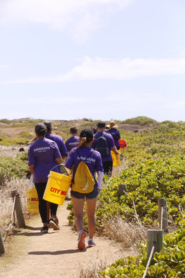 Team Kōkua, Hawaiian Airlines' employee volunteer group, at a clean-up event at Oʻahu's Kaʻena Point State Park.