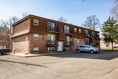 Properties available in the June 14 auction include this 22,500-sq.-ft. Manhattan, KS parcel that currently houses a 12-unit apartment building and a single-family home. Located one block from Kansas State University, this Opportunity Zone property offers opportunities for additional new construction.