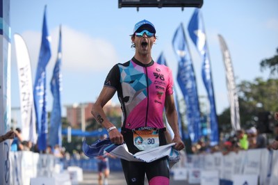 Matthew Sharpe, of Boulder, CO, won his first St. Anthony’s Triathlon men’s championship in dramatic style, beating out Matt McElroy by one one-hundredth of a second in the 39th race.