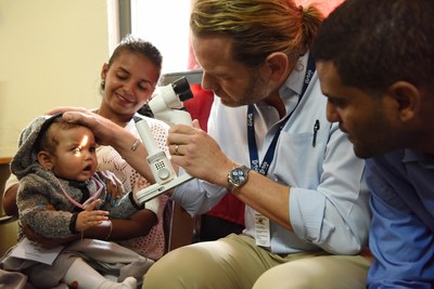 Nine-month-old Mary, who was born with glaucoma, is examined by Orbis Volunteer Faculty surgeon Dr. Daniel Neely during a Flying Eye Hospital program in Ethiopia in 2018. The virtual Flying Eye Hospital program launched today will help eye care professionals in the country build their skills to treat glaucoma and cataract, leading causes of blindness and visual impairment, through online training. Photo: Geoff Oliver Bugbee/Orbis