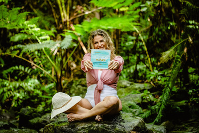 Entrepreneur, travel lover and Founder & CEO of Dune Jewelry & Co, Holly Daniels Christensen celebrating her first book release - "Happiness Comes in Waves," in the rainforest of San Juan, Puerto Rico. Photo credit: Samantha Robshaw Photography.