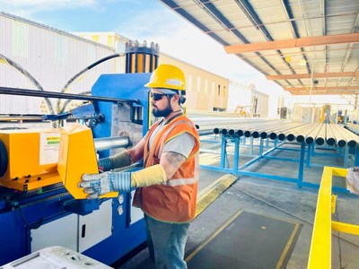 Steel line worker at Atkore's new Nextracker-dedicated production line for torque tubes used on utility-scale solar power plants in the southwest. Photo: Nextracker