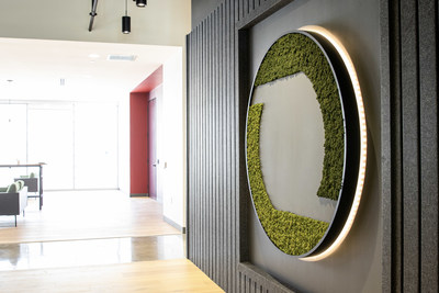 Living green wall in the shape of the Omni Logistics logo in the Dallas Headquarters' lobby.