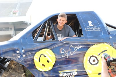 MEMPHIS, Tenn. (May 23, 2022) - Feld Entertainment® surprised St. Jude Children's Research Hospital® patient Calvin, 13, with 12,000-pound Monster Jam monster truck adorned with artwork he created when Monster Jam drivers visited St. Jude. The unveiling took place during the Monster Jam World Finals® May 21 to 22, in Orlando, Florida, at Camping World Stadium.  Photo credit: Feld Entertainment