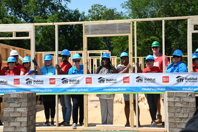 Wells Fargo volunteers help build Habitat for Humanity home alongside Shaquawanda Boulware (center) in Charlotte, North Carolina