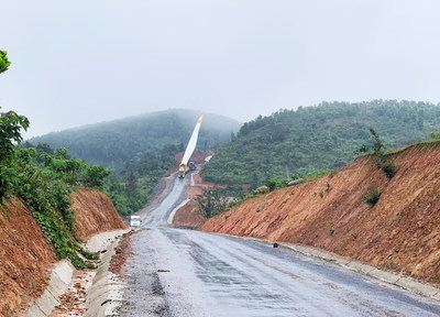 Transportation of wind turbine components through remote areas of Vietnam for wind farm projects.