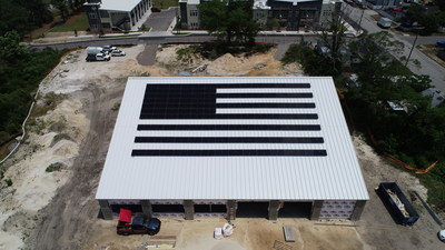 Aerial view of Cape Fear Solar Systems solar panels in the shape of an American flag located at 901 South Front Street in Wilmington, NC.