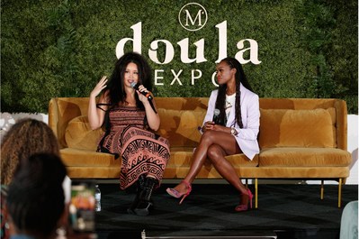Jillian Hervey of the electronic music duo, Lion Babe, in conversation on the main stage with Latham Thomas, founder of Mama Glow at the 2022 DOULA EXPO by Mama Glow. Jillian performed her hit single "Treat Me Like Fire."