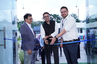 Ascend's Dharm Vahalia, managing director for India, and Mark Power, strategy and growth director, cut the ribbon on the company's purchase in Chennai, India.