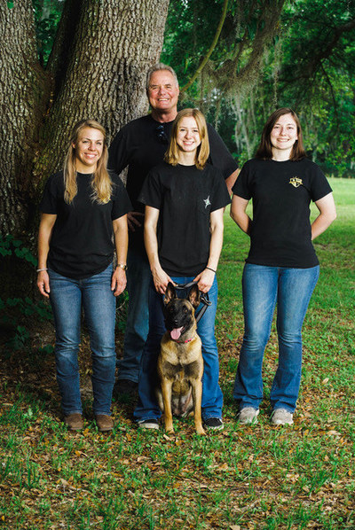 Jeff Minder, CEO & Founder of Top Tier K9, with his team