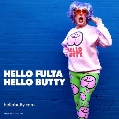 Fulta models the Hello Butty® unisex logo sweatshirt in pink and pattern leggings in lime green. hellobutty.com