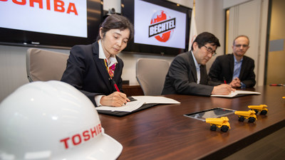 Bechtel’s Ahmet Tokpinar (right) signs the memorandum of understanding with Toshiba executives Kentaro Takagi (center) and Yuri Arima to pursue a new civil nuclear power plant project in Poland.