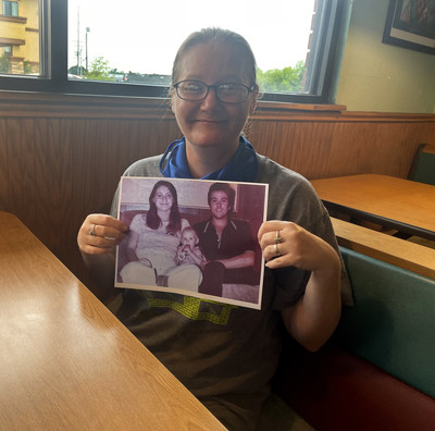 The former Holly Marie Clouse with a photo of her parents Dean and Tina Clouse who were found murdered in Houston in January, 1981 moments after meeting Texas investigators.