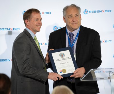 Montgomery County Executive Marc Elrich presents REGENXBIO President and CEO Ken Mills with a Certificate of Recognition at the grand opening of the company’s Manufacturing Innovation Center