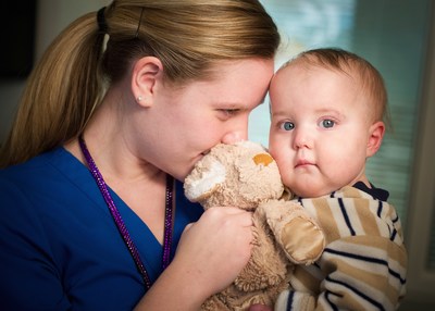 St. Jude nurse Dana O’Neill, RN, comforts her patient and his special bear.