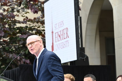 President Gerard J. Rooney revealed Fisher's new university status and logo during a celebratory event.