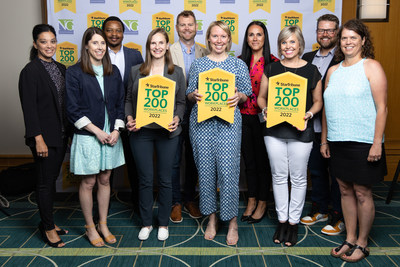 Team Pioneer graciously accepts award at Top Workplaces luncheon.
