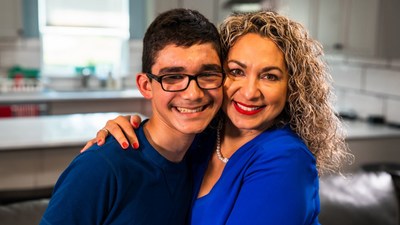 Junior, recipient of UHCCF's 30,000th grant (left), and his mother, Joan (right).